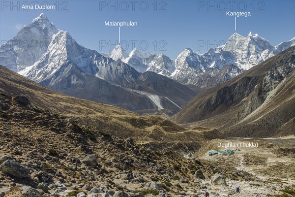 Looking back from the steep approach to Thokla on the Everest Base Camp trekking route. Dughla settlement is below, located on the way between Dingboche or Pheriche and Lobuche. It is Ama Dablam on th...