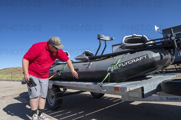 Evanston, Wyoming, An employee of the Wyoming Game & Fish Department inspects watercraft at a mandatory inspection station along the Utah border. The intent is to keep invasive aquatic species, includ...