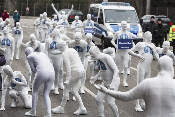 Protest of the environmental organisation Greenpeace, on the Bundesstrasse 14 40 activists demand better air quality, the Neckartor is considered the most polluted street in Germany with high levels o...