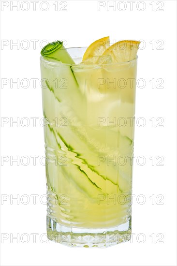 Tall glass of cold lemon and cucumber lemonade isolated on white background