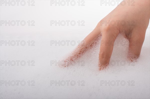 Hand washing and soap foam on a foamy background