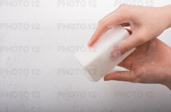 Hand washing and soap foam on a foamy background