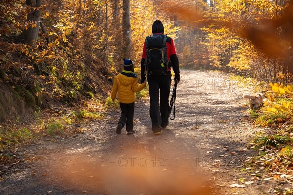 Mum and child are walking along the mountain hiking trail. Family spending time. Polish mountains