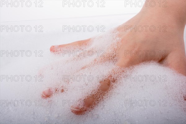 Hand washing and soap foam on a foamy background