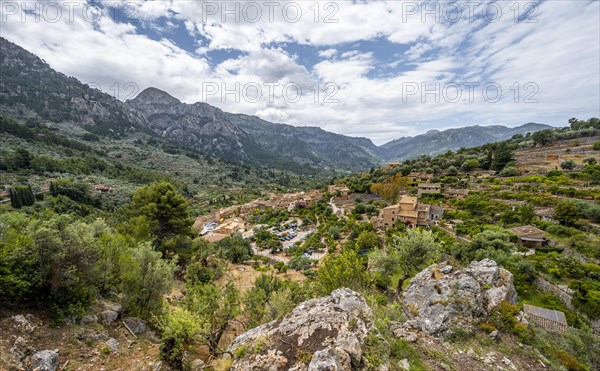 View of typical houses of the mountain village Fornalutx with mountain landscape