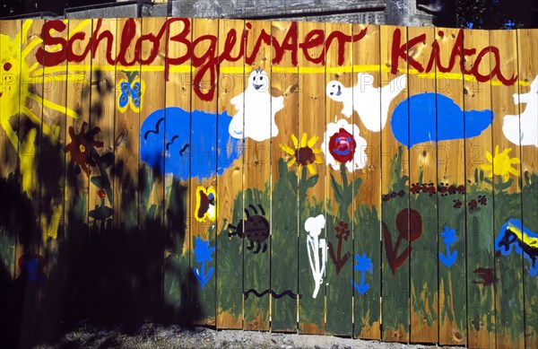 Graffiti on a board wall