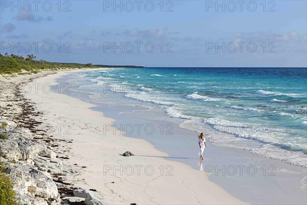 Tourist on the beach of Highbourne Cay