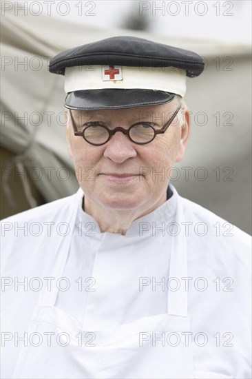 Volunteer of the Red Cross presents a historical outfit