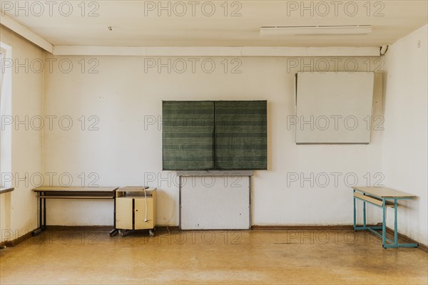 A blackboard in an empty classroom of the old primary school in Trinwillershagen