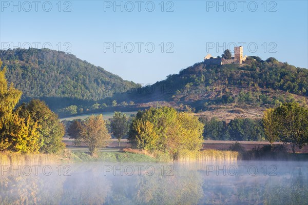 Landscape with lake with morning mist in autumn
