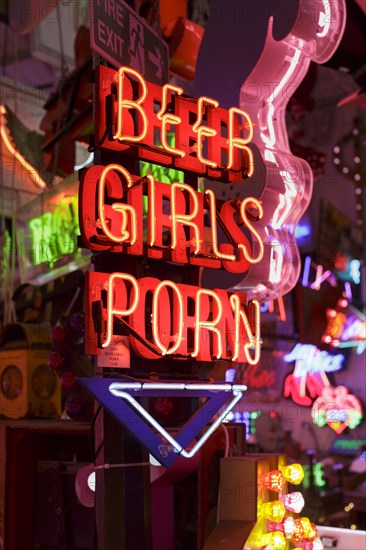 Room full of bright colourful neon signs