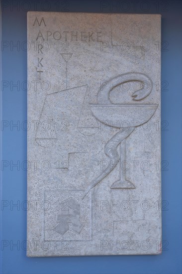 Emblem of the pharmacy and historical pharmacy with inscription