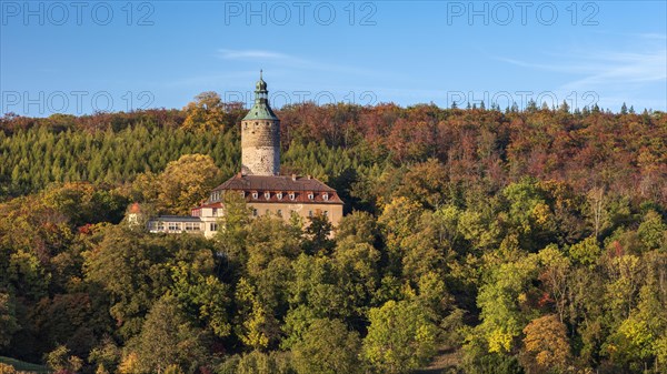 Tonndorf Castle surrounded by forest in autumn