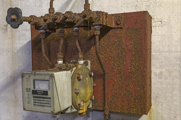 Rusted steam regulator of a former paper factory