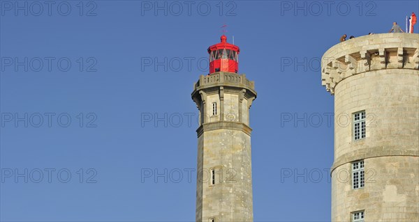 The old Tour Vauban and the new lighthouse Phare des Baleines on the island Ile de Re