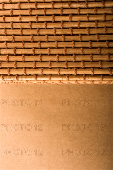 Straw mat and brown background for background usage
