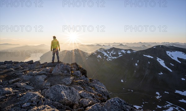 Hiker looking into the sunset