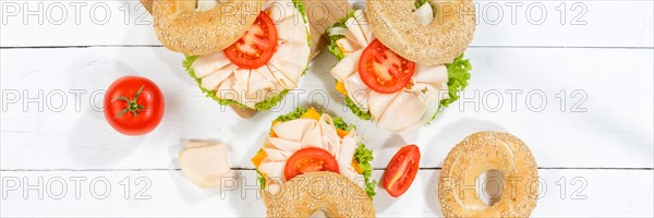 Bagel sandwich for breakfast topped with chicken ham from above Panorama in Stuttgart