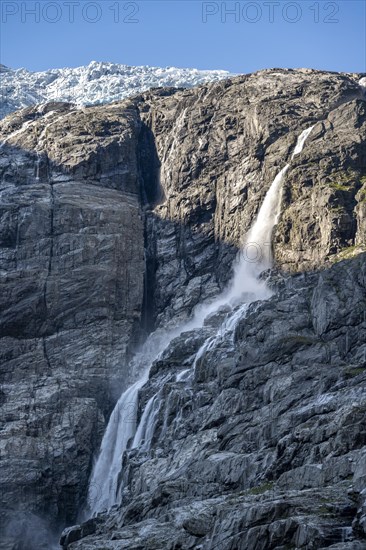 Waterfall at the glacier tongue Kjenndalsbreen