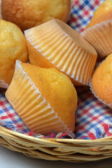 Several muffins in baskets