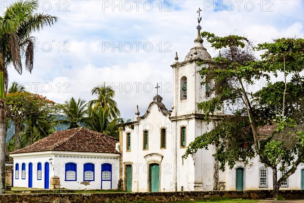 Famous churche between th vegetation in the ancient and historic city of Paraty on the south coast of the state of Rio de Janeiro founded in the 17th century