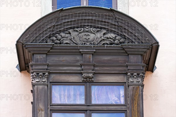 Detail of the historic oriel with pigeon grille