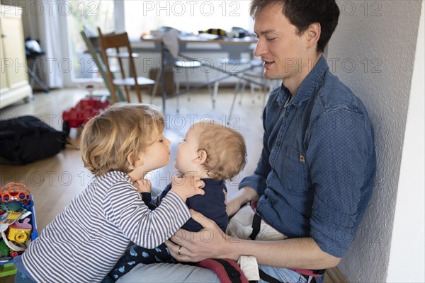 Subject: Father with two children aged nine months and three years.