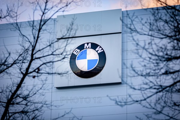 A sign of the car manufacturer BMW in front of a branch in Siemensstadt in Berlin