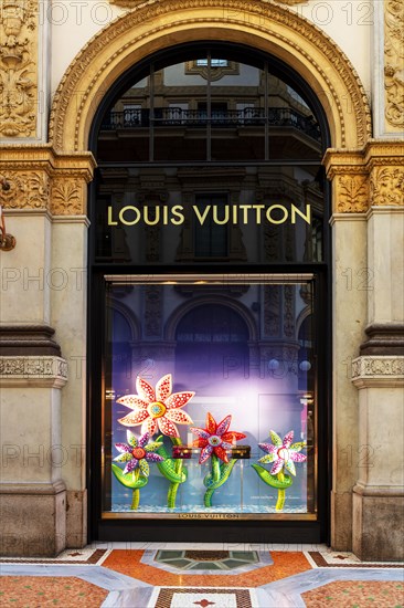 Shop window of the luxury shop LOUIS VUITTON at Galleria Vittorio Emanuele II