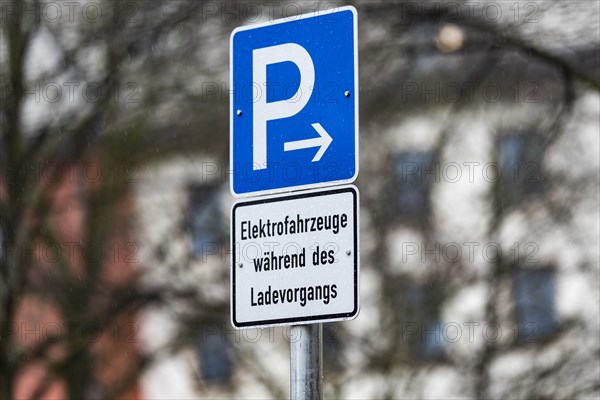 A parking sign for electric cars