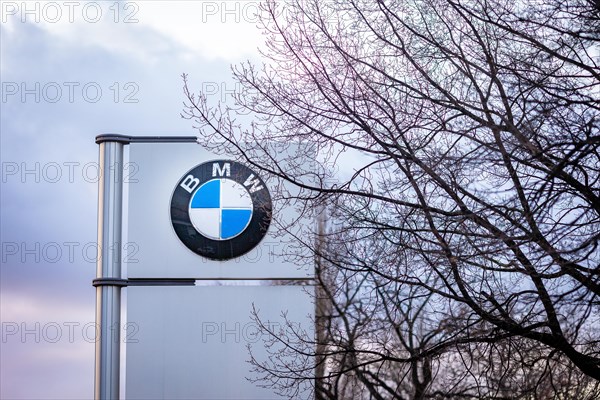 A sign of the car manufacturer BMW in front of a branch in Siemensstadt in Berlin