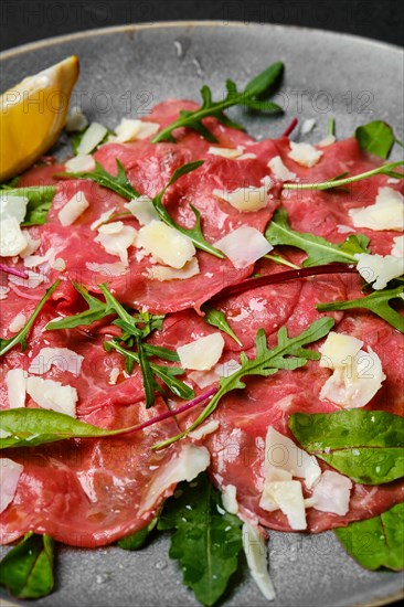 Marbled beef carpaccio with arugula and chard leaves