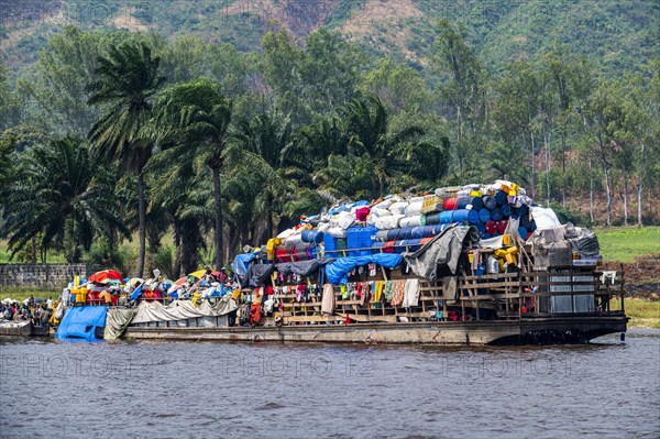 Overloaded riverboat on the Congo river