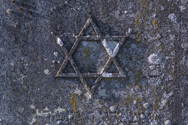 Jewish star on an old gravestone