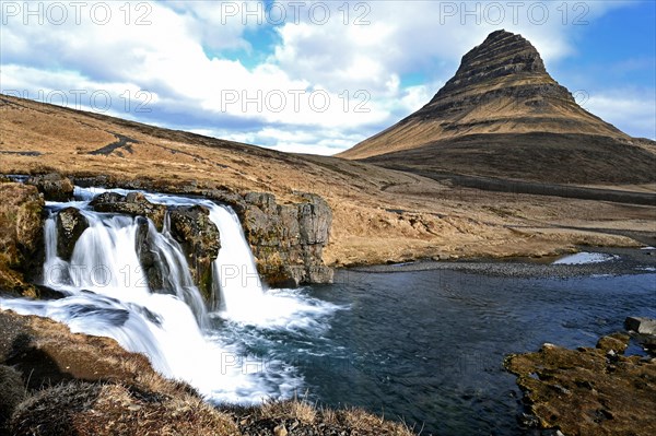 Kirkjufellsfoss waterfall and Kirkjufell mountain on the north coast of the Snaefellsnes peninsula in western Iceland