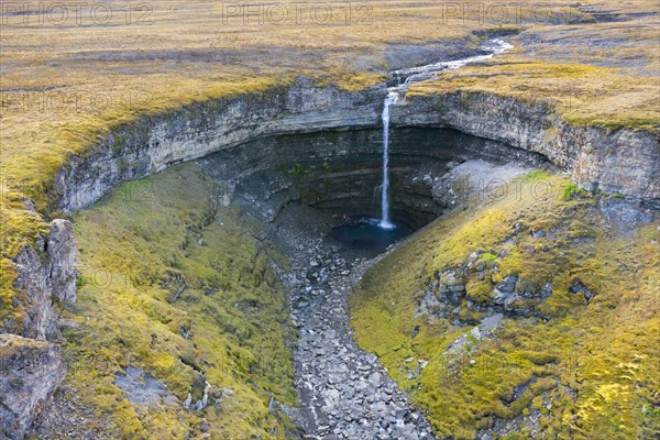Waterfall Hemsilfossen on the Hemsil river at Ekmanfjorden in summer