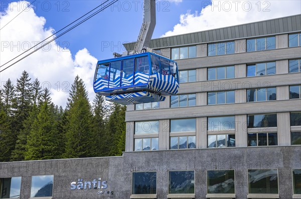 Gondola of the Schwaegalp-Saentis cable car against the backdrop of the valley station