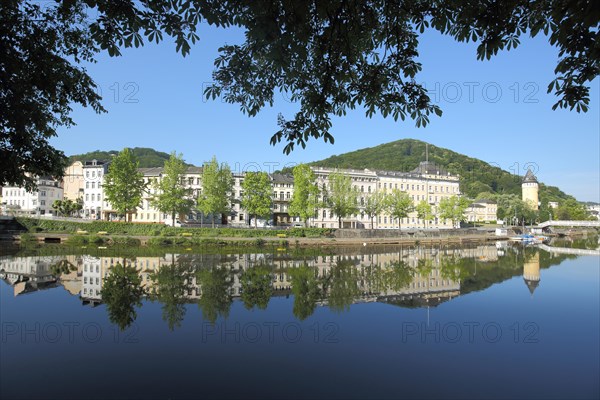State Statistical Office on the banks of the Lahn and spring tower with reflection in the water