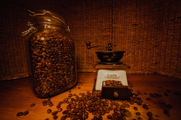 Jar with coffee beans on the wooden table