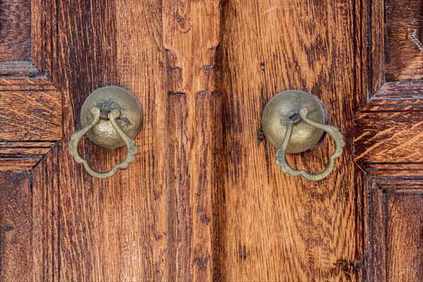 Old Handmade ottoman door knob on wood