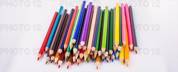Color pencils and back to school title on a notebook