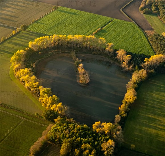 Aerial view of a lake in the shape of a heart north of Luenen
