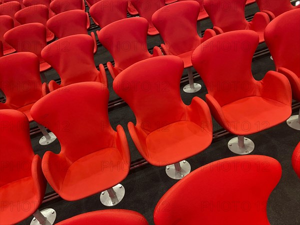 Red chairs in the press centre