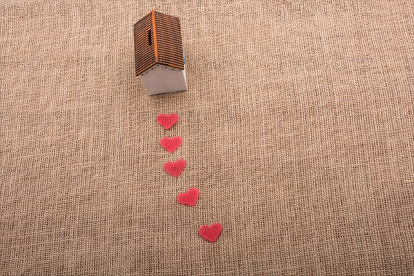 Model house and a heart shape beside it
