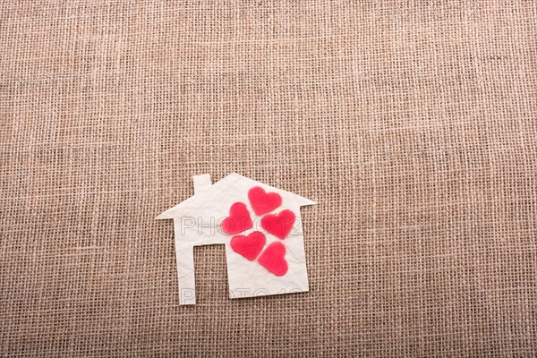Model house and a heart shape beside it