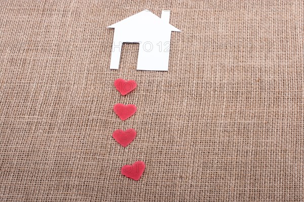 Model house and a heart shape beside it