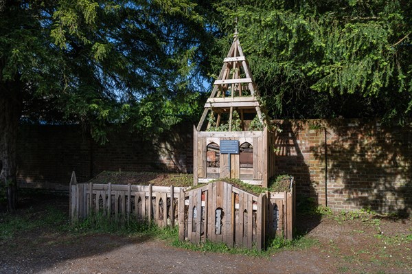 Wooden insect hotel built in the style of Salisbury Cathedral