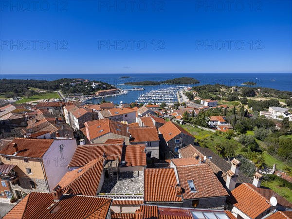 View over the roofs of the town of Vrsar to the harbour