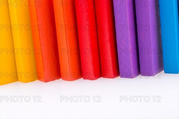 Colorful Domino Blocks in a line on a white background