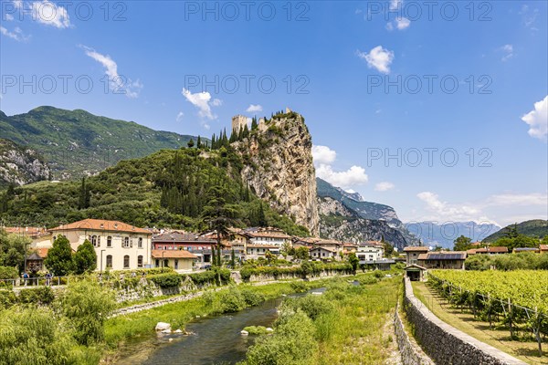 Town view of Arco with the Sarca River and the ruins of Arco Castle